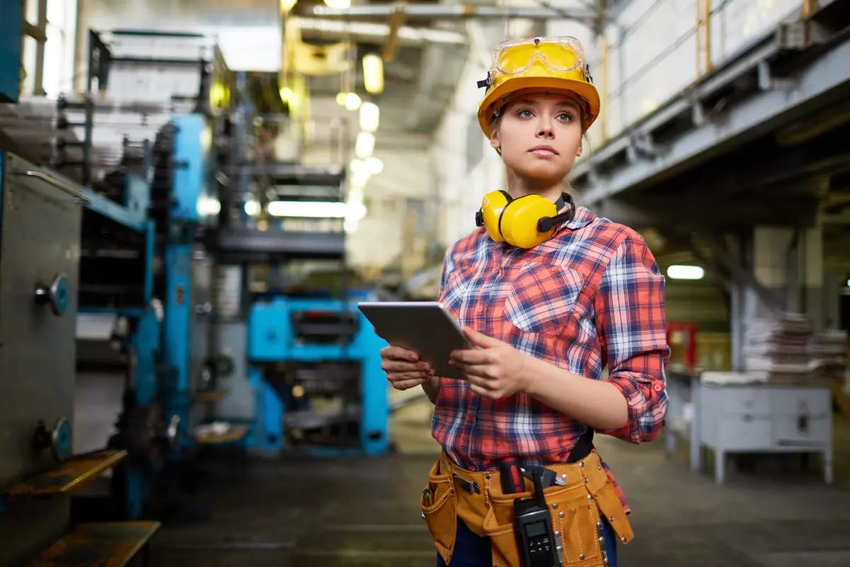 Female construction worker holding an iPad
